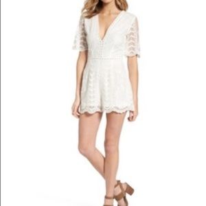 The WHITE version of this plunge lace romper